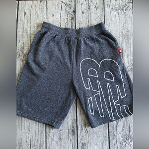 Like new. New Balance shorts Youth XL (18-20). Side pockets. Gray color